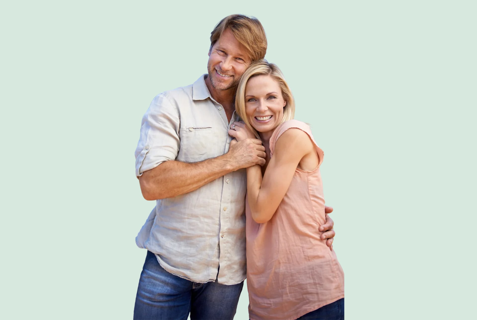 A couple in a warm embrace, both smiling