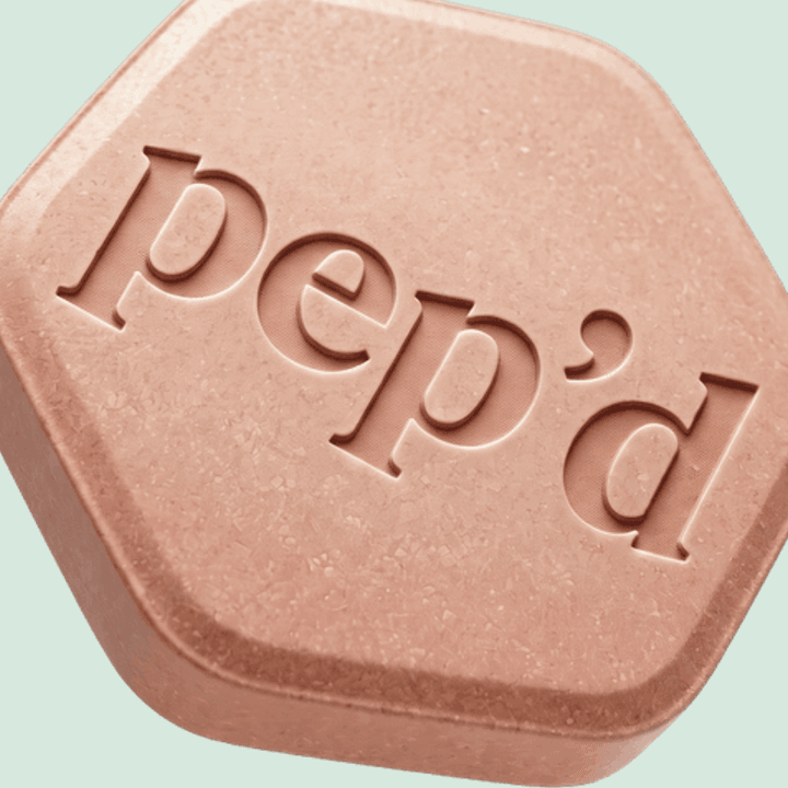 Pep’d Oral Minoxidil Rx close up on a deeper mint background