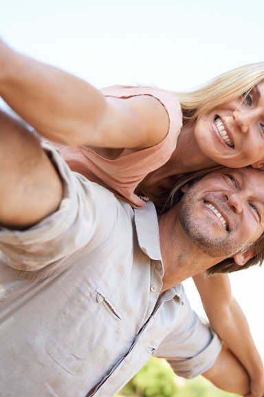 Stock lifestyle photo of a couple outdoors, standing in for a progress photo